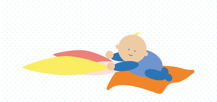 Baby playing and crawling on pillows 