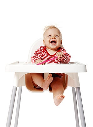 Baby in feeding highchair