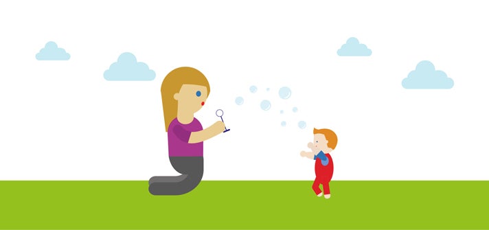 Mum and toddler blowing bubbles together
