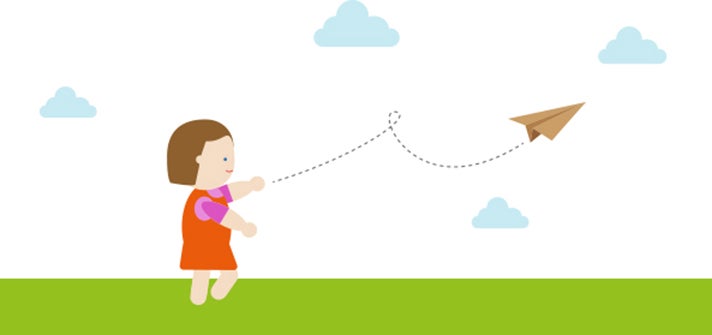 Toddler playing with their paper airplane