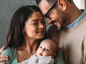 mother and father holding their baby mother and father holding their baby