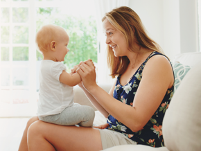 mother and baby sitting together on lounge