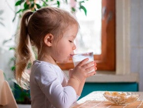 Infant girl drinking milk Infant girl drinking milk