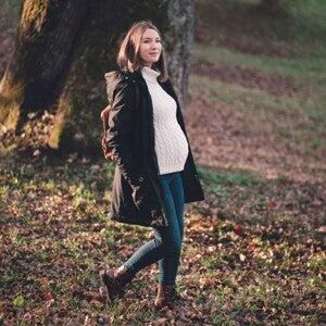 Pregnant woman on a bushwalk in a forest