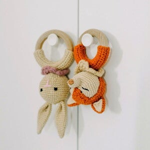 Baby wooden teething toy rabbit and fox hanging on hooks