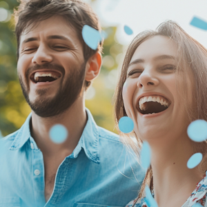 Couple smiling with blue confetti Couple smiling with blue confetti