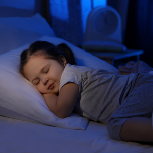 Toddler girl asleep in bed