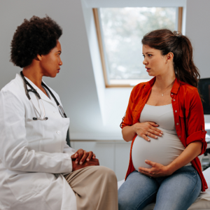 pregnant lady talking to a doctor