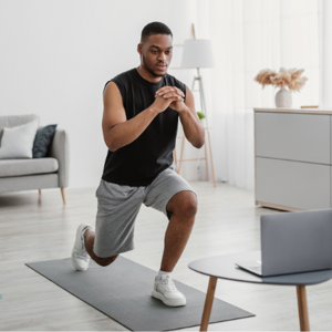 A man exercising on a mat