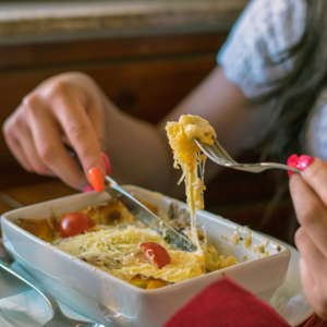 woman eating heated up dinner