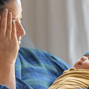 mum with baby looks tired