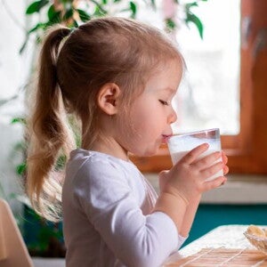 Infant girl drinking milk