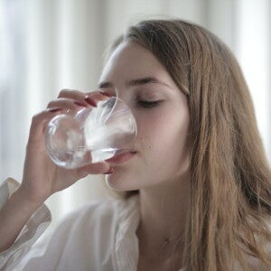 Woman drinking water from a glass