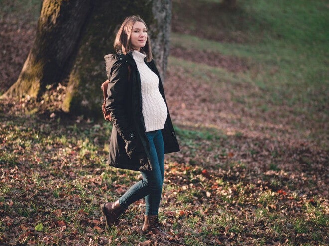Pregnant woman on a bushwalk in a forest Pregnant woman on a bushwalk in a forest