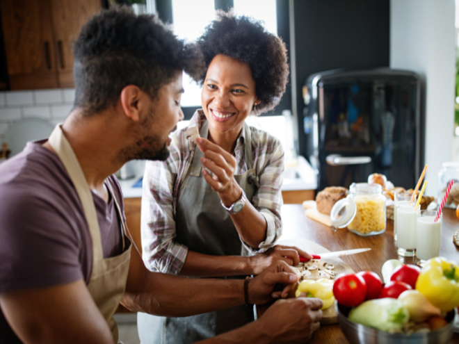 woman and man eating in the kitchen woman and man eating in the kitchen