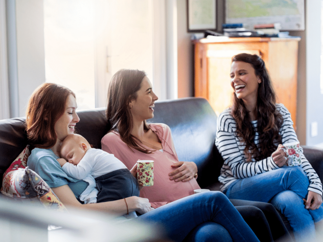 women laughing pregnant and baby women laughing pregnant and baby