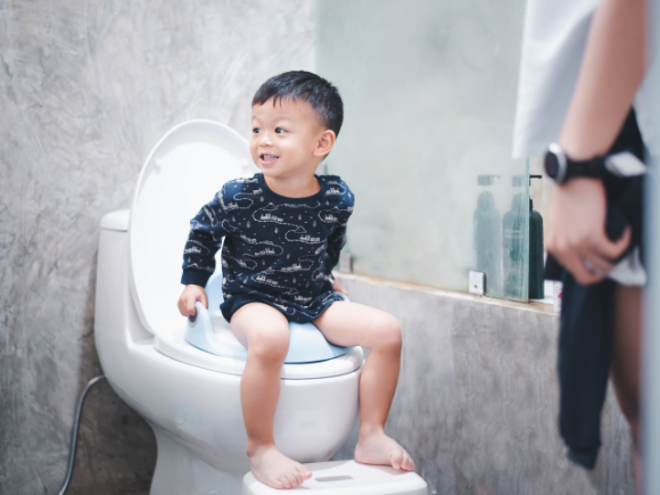 Toddler boy sitting on the toilet Toddler boy sitting on the toilet