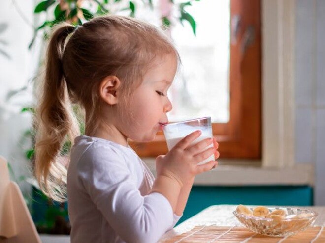 Infant girl drinking milk Infant girl drinking milk
