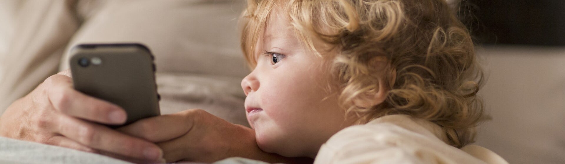 toddler looking at phone toddler looking at phone
