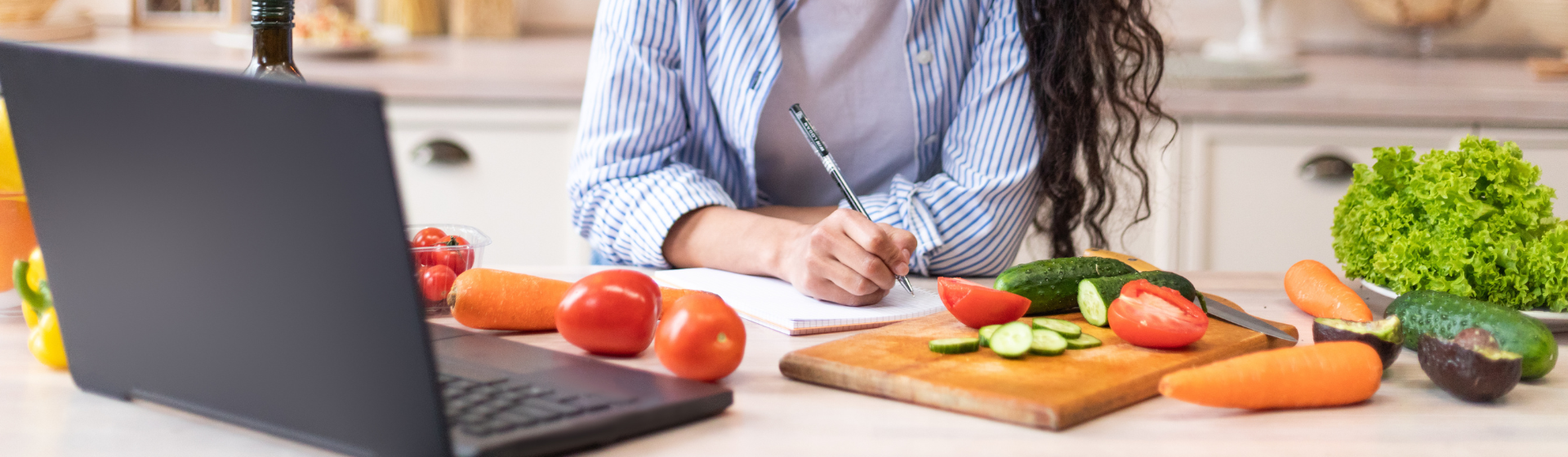 writing down a menu in the kitchen with food around writing down a menu in the kitchen with food around
