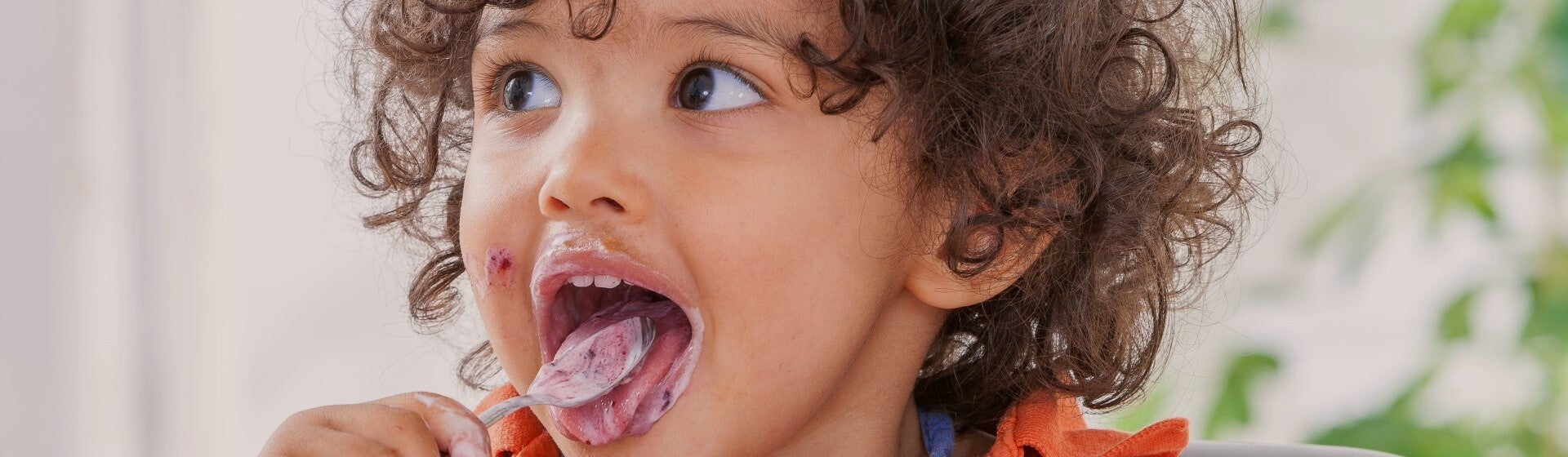 toddler eating yoghurt toddler eating yoghurt