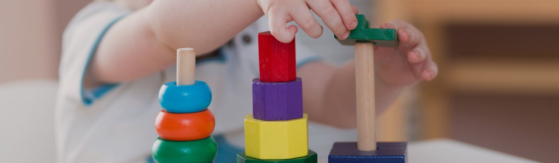 toddler playing with wooden blocks toddler playing with wooden blocks