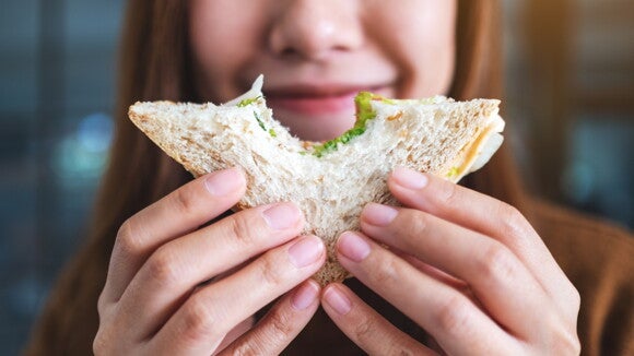 Women eating a sandwich Women eating a sandwich