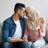 man and woman looking intimate holding pregnancy test